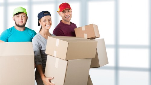 Moving team loading furniture into a van near Richmond homes