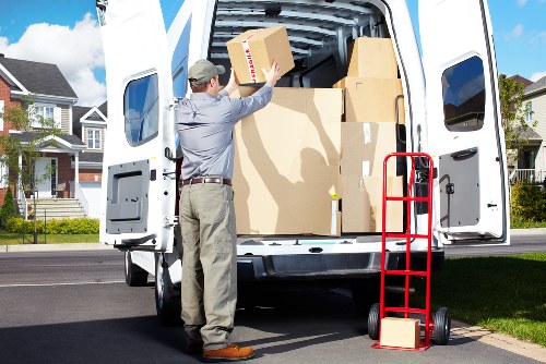 Local movers unpacking boxes in a Richmond property room by room