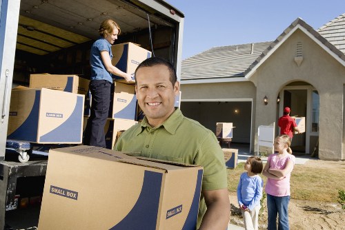 Packed boxes and furniture ready for relocation